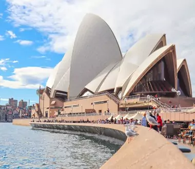 People gathering outside Sydney Opera House. 