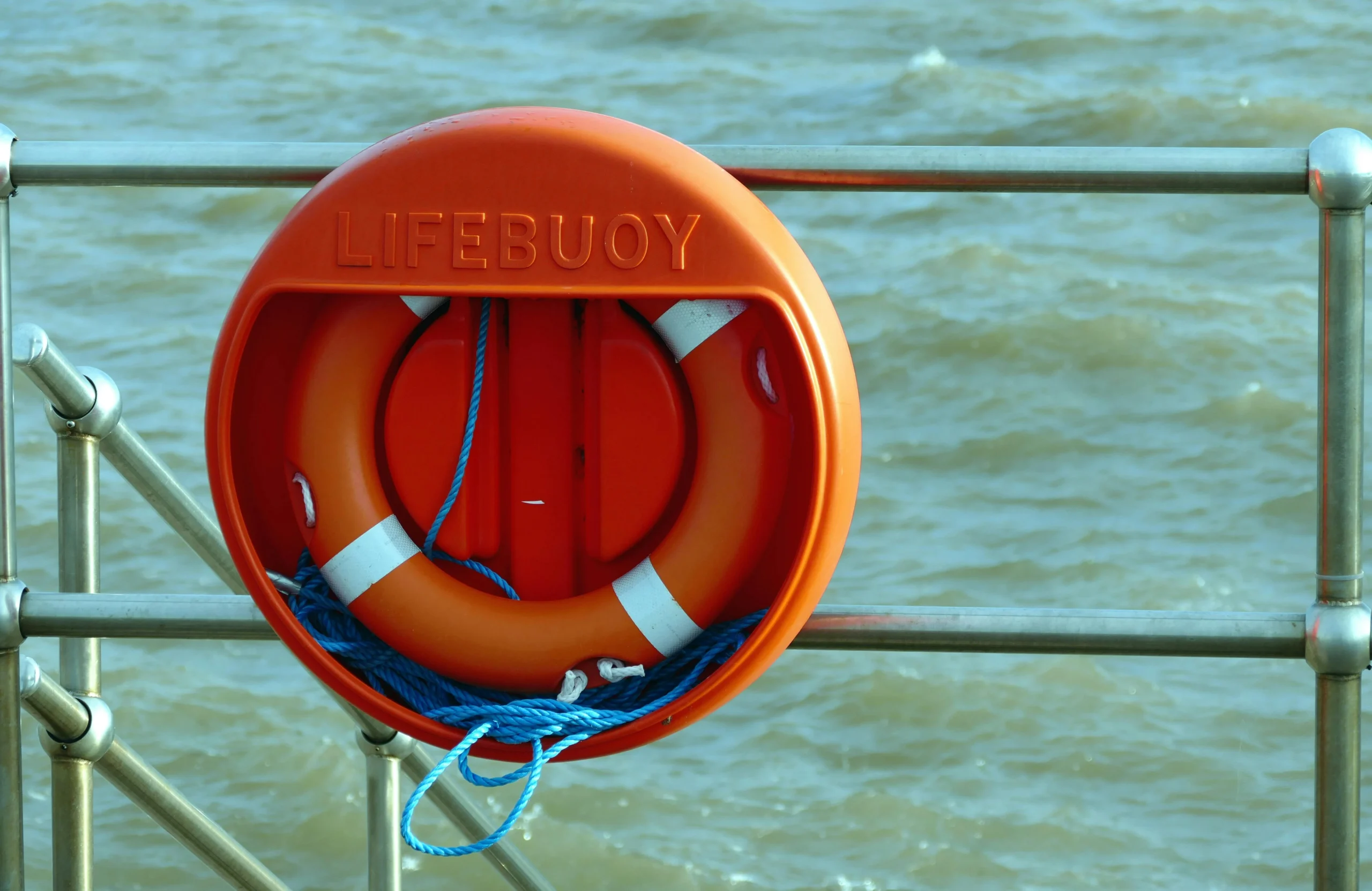 A photo of an orange lifebuoy.