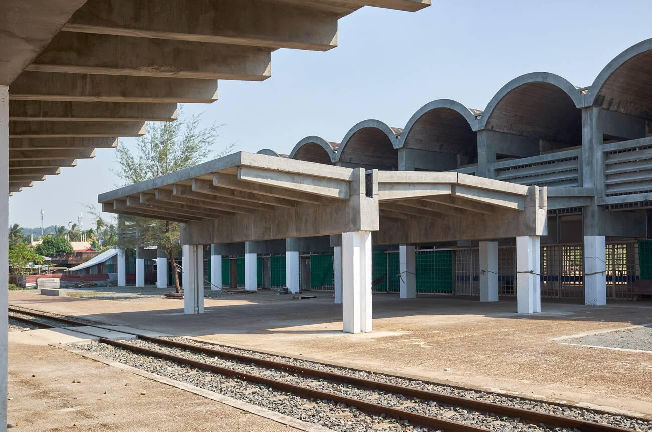 A railway station with modern architectural designs and concrete structures 