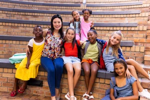 portrait-of-diverse-female-teacher-and-schoolgirls-2023-11-27-05-19-13-utc - Travelpreneur