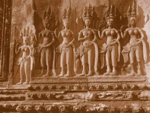 Intricate carvings of Apsara dancers on the walls of Angkor Wat, showcasing ancient Khmer artistry