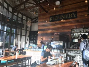 Rustic-style Refinery café with wooden walls and cozy atmosphere.
