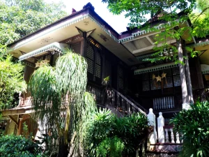 A stunning heritage house with lush gardens and intricate details