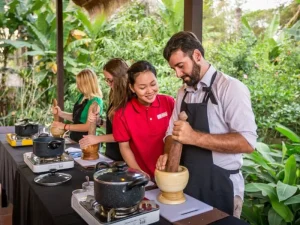 Cooking Class - Travelpreneur Tourists participating in a Cambodian cooking class outdoors