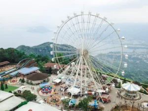 Aerial view of Sky Ranch ferris wheel overlooking Taal Volcano