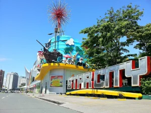 Star City - Travelpreneur Vibrant amusement park entrance of Star City with a pirate ship and colorful signage