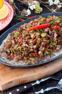 sizzling sisg on an iron plate