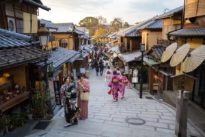 tourists-walking-gion-district-kyoto-japan-march-kyoto-japan-74122355 - Travelpreneur a virbant and bustling street of Gion District taken from street near Gion Corner