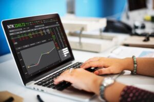 a laptop showing that the person using is on forex trading