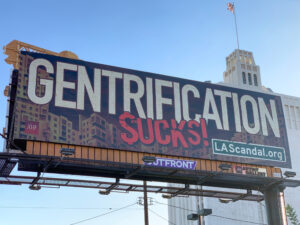 a billboard of the word Gentrification sucks