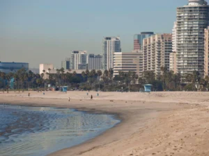 View of Long Beach buildings lining the calm beachfront shore