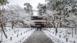 a shot of the temple entrance during winter where everything is covered in snow