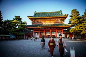 the front of heian shrine with tourist or people going in and out of the shrine