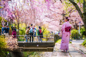 woman-path-philosophers-walk-cherry-blossom-sakura-season-kyoto-japan-bricker