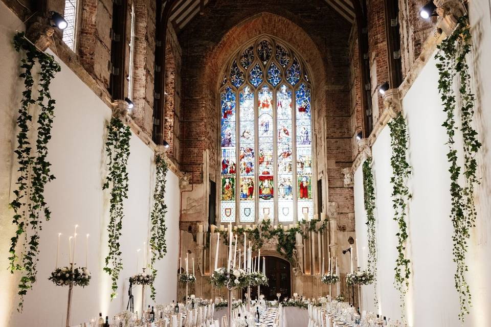 Highcliffe Castle Great Hall and iconic glass window decorated for an event