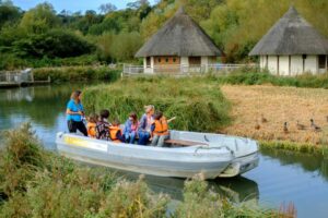 Arundel Wildfowl and Wetlands Centre with visitors riding the boat