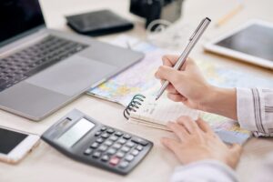 b7 - Travelpreneur a person calculating and planning