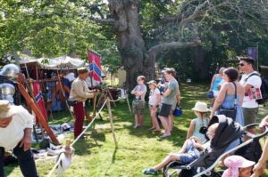 People gathering at a seasonal event at Herstmonceux Castle