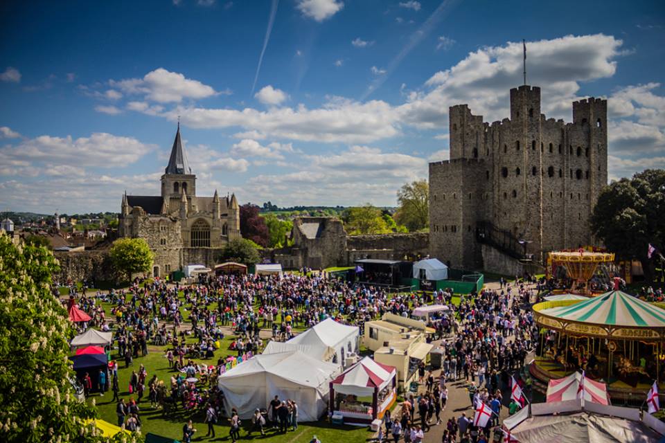 Rochester Castle during a seasonal event full of people and vendor