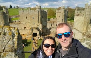 a beautiful couple taking a picture at the tower