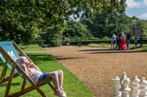Oxburgh Estate Activity Hall with children and adults walking along the path