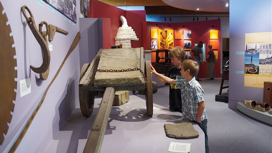Cliffe Castle interactive museum where two kids are seen interacting and touching the exhibit.