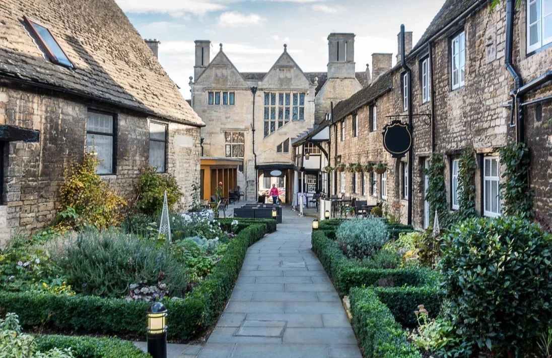 a beautiful oudle street with vintage house and lively garden