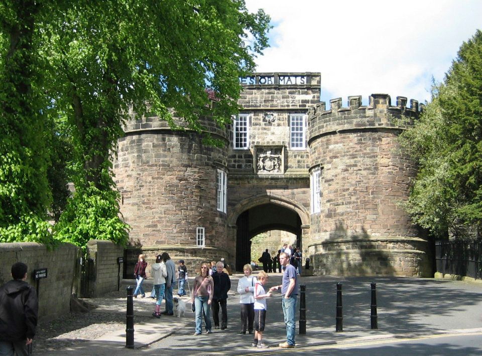 Skipton Castle gatehouse full of visitors