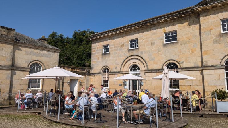 Castle Howard courtyard cafe - Travelpreneur Castle Howard courtyard cafe full of happy and dining tourist.