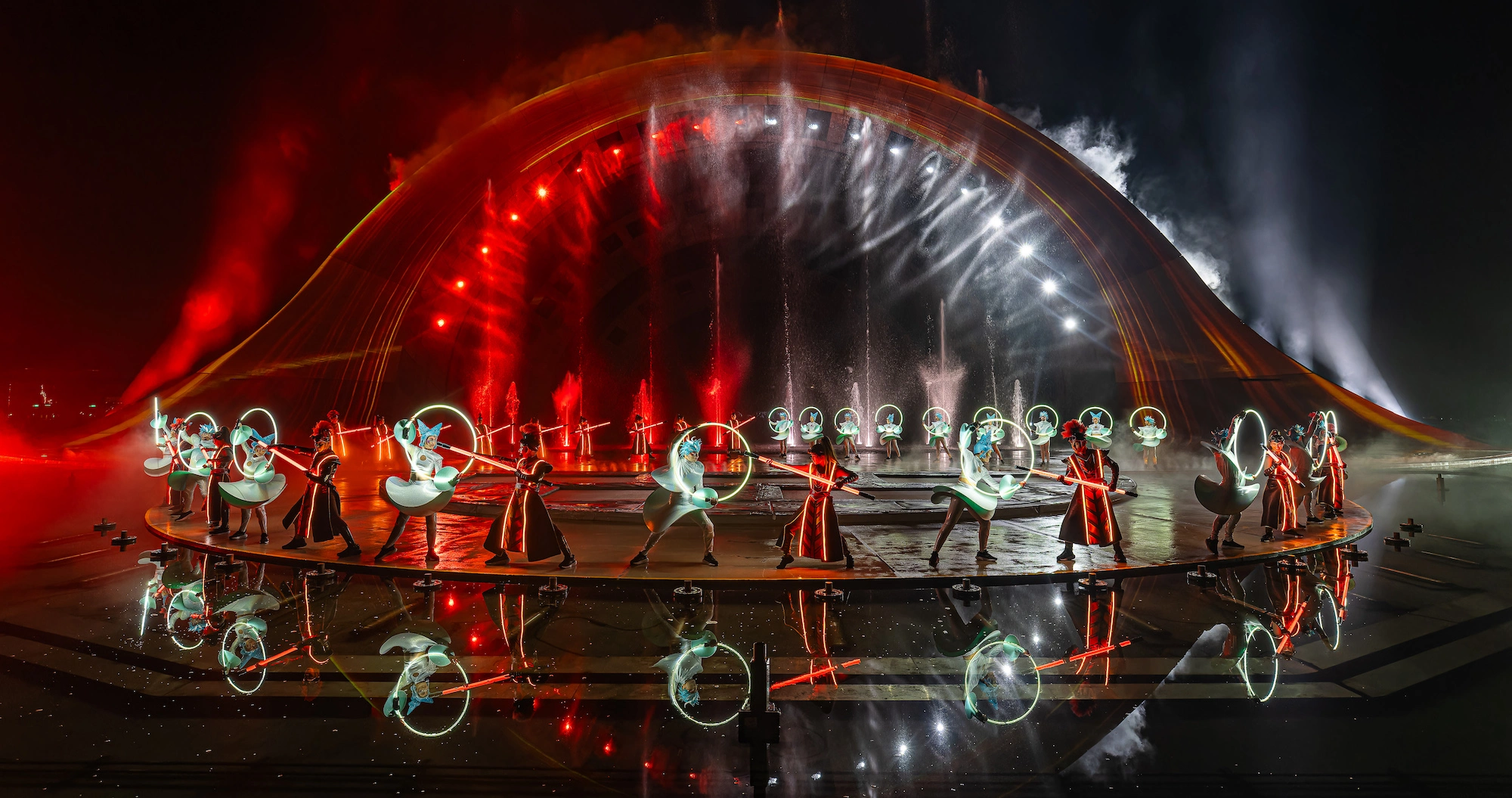 Kiss of the Sea Phu Quoc story performance where the performers are red and white colors
