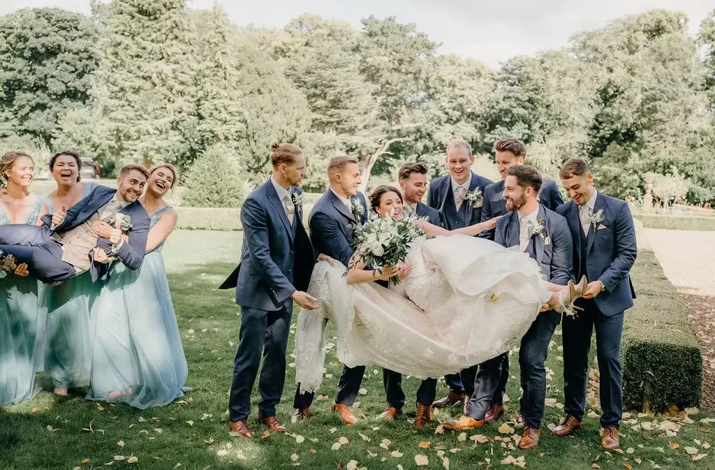 wedding at castle eden - Travelpreneur a beautiful bride and groom with their bridesmaids and grooms men