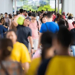 Crowded walkway shows commuters in motion, soft blur, Holidays in the Philippines city rush hour
