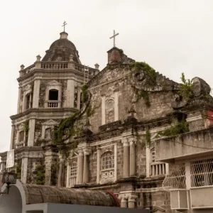 Weathered stone church ruins with crosses and vines, Holidays in the Philippines heritage landmark photo